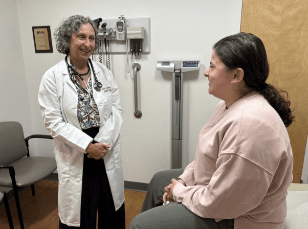 Doctor speaking with a patient in an examination room